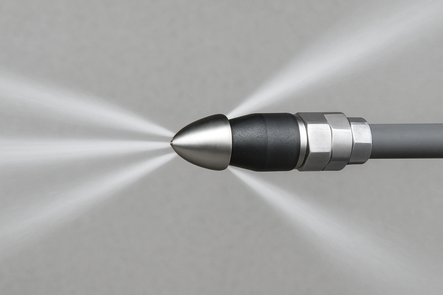 Close-up of a hydro jetting nozzle used by Drainstar Plumbing Inc. to clear grease and roots