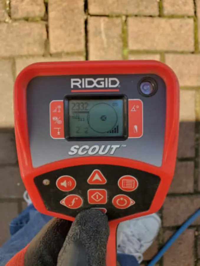 Screen of a Ridgid Scout locator tool used by Drainstar Plumbing Inc. to read depth and direction of underground pipes