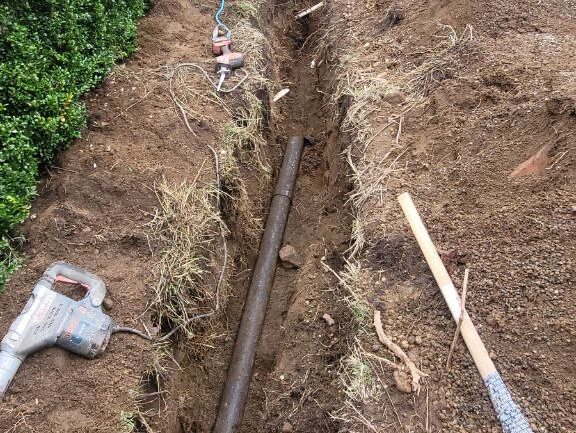 An old rusted cast iron pipe being replaced by Drainstar Plumbing Inc