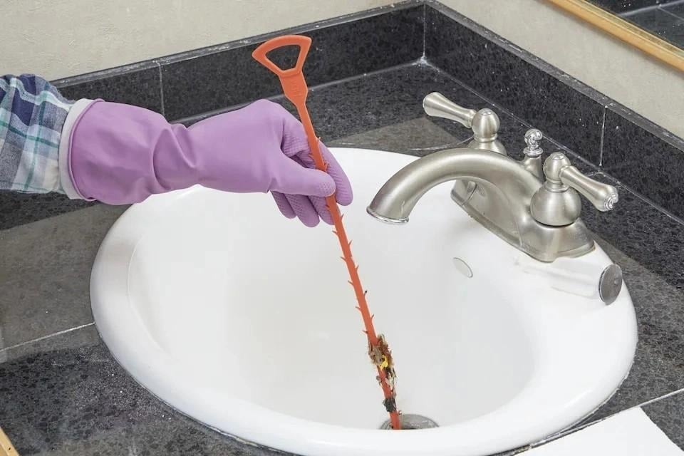 Professional drain cleaning service by Drainstar Plumbing technician